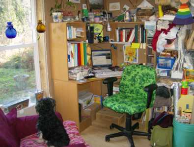 my desk with green chair cover